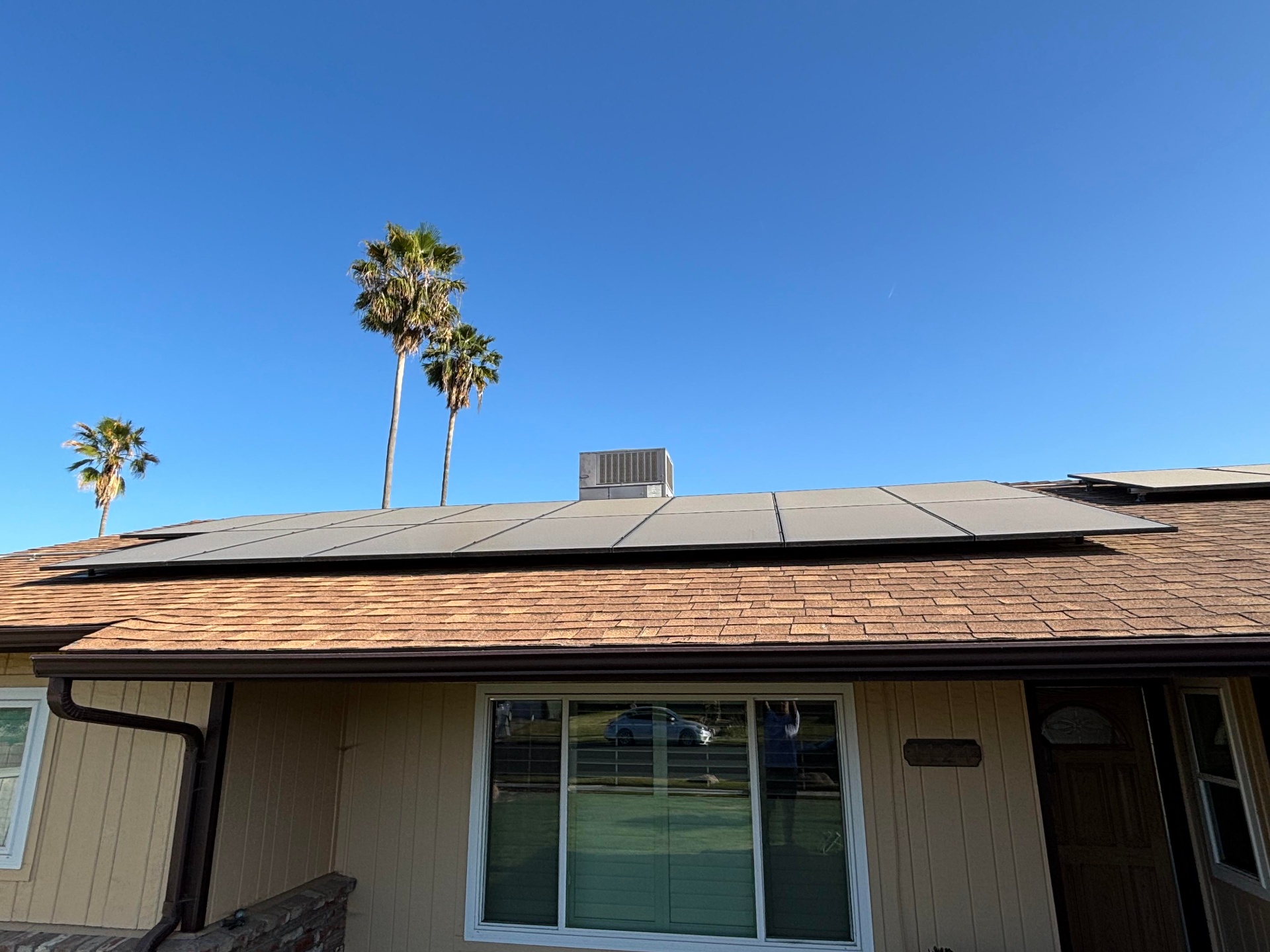 Solar panels on residential roof before cleaning service